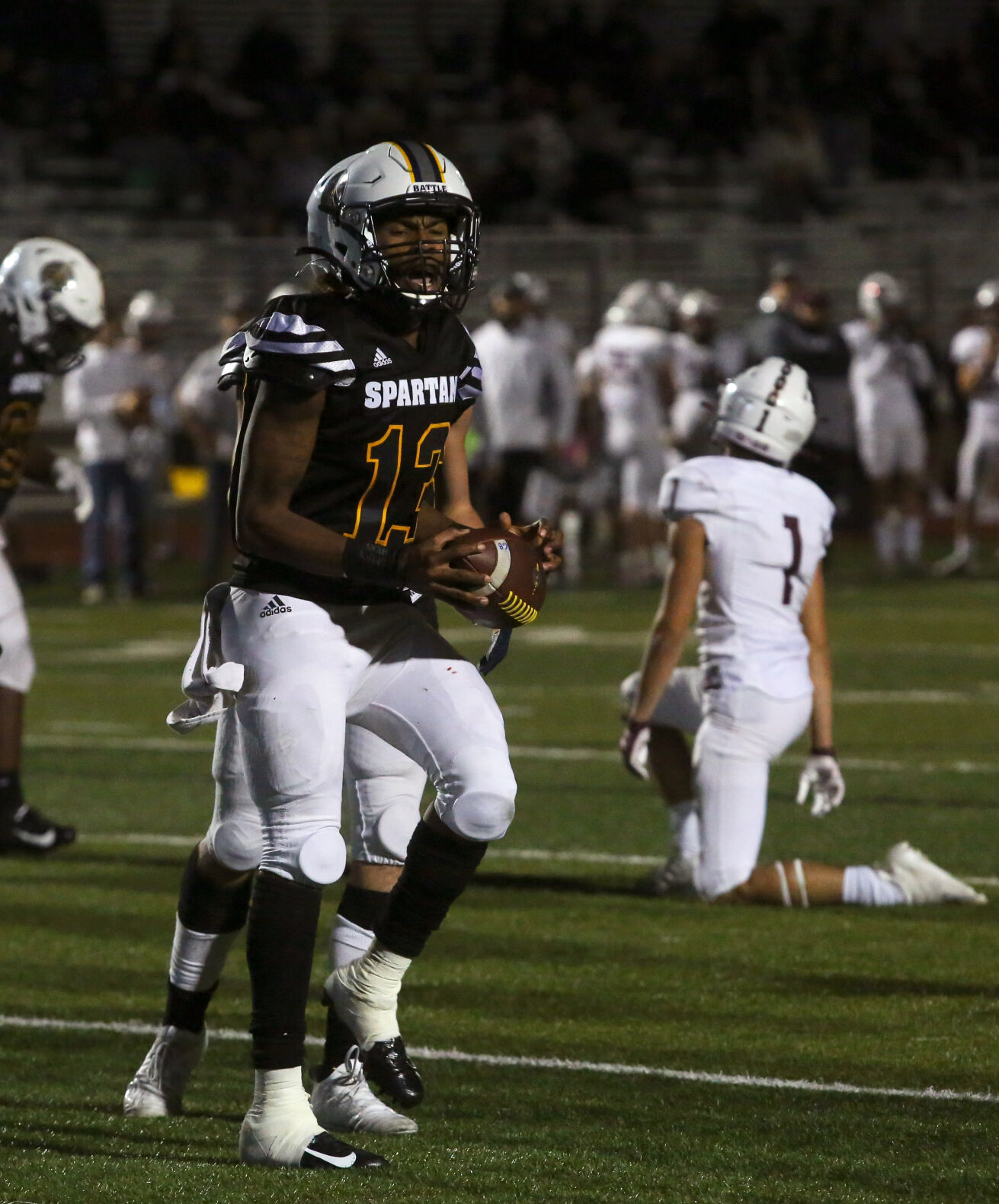 Battle senior Khaleel Dampier celebrates after completing a two-point conversion